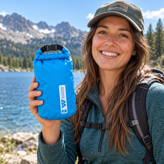 Wilderness Technology Ultralight Dry Bag 2L in Dark Teal, in use outdoors