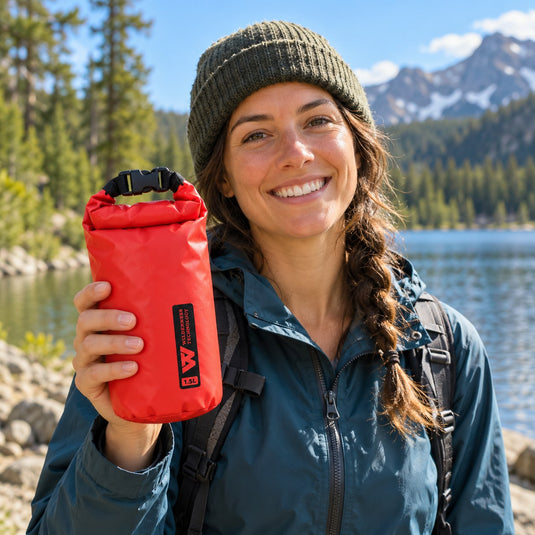 Wilderness Technology PVC Dry Bag 1.5L in Red, in use outdoors